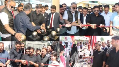 ArchEx Srinagar 2026 exhibition में modern architecture और building material stalls का निरीक्षण करते Satish Sharma