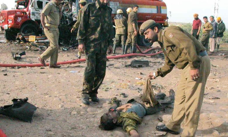 Fire brigade team controlling massive fire after LPG cylinder blast in Trikuta Nagar Jammu slum area