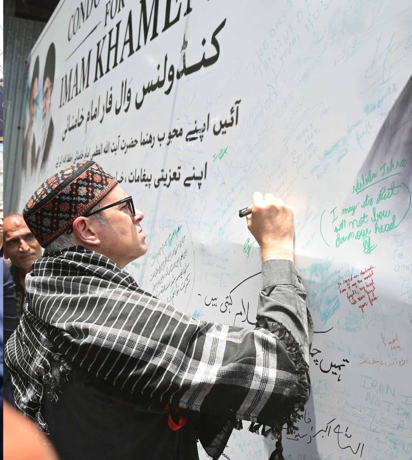Omar Abdullah distributing water at Ashura