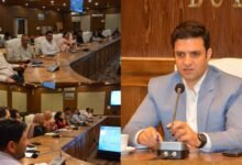 Deputy Commissioner Athar Aamir Khan reviewing Census 2027 preparations in Budgam district with officials during a meeting.