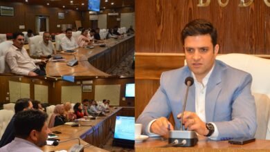 Deputy Commissioner Athar Aamir Khan reviewing Census 2027 preparations in Budgam district with officials during a meeting.