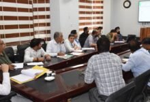Agriculture Scheme Review meeting showing DC Minga Sherpa reviewing progress of HADP, PM-Kisan and KCC schemes with officials in discussion meeting room