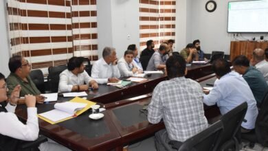 Agriculture Scheme Review meeting showing DC Minga Sherpa reviewing progress of HADP, PM-Kisan and KCC schemes with officials in discussion meeting room