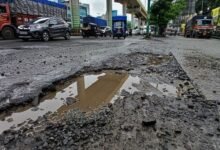 Worsening Toph Sherkhanian Bridge condition with deep potholes and slow moving traffic in Jammu