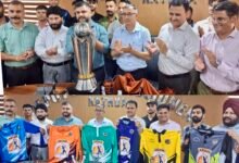 Deputy Commissioner unveiling Kathua Cricket League trophy and team kits