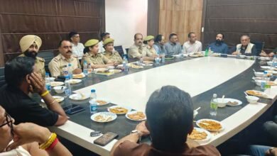 Officials inspecting Jammu Fruit Prices at a wholesale fruit market