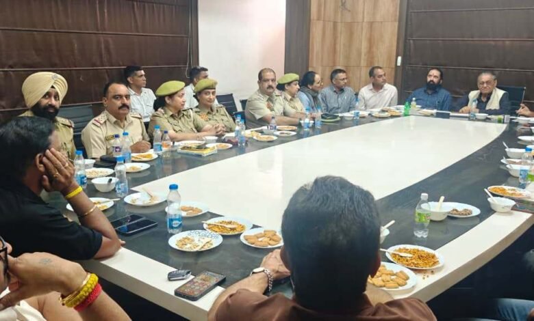 Officials inspecting Jammu Fruit Prices at a wholesale fruit market